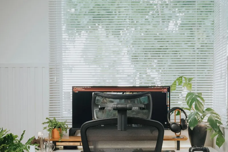 Modern ergonomic home office with standing desk and mesh chair
